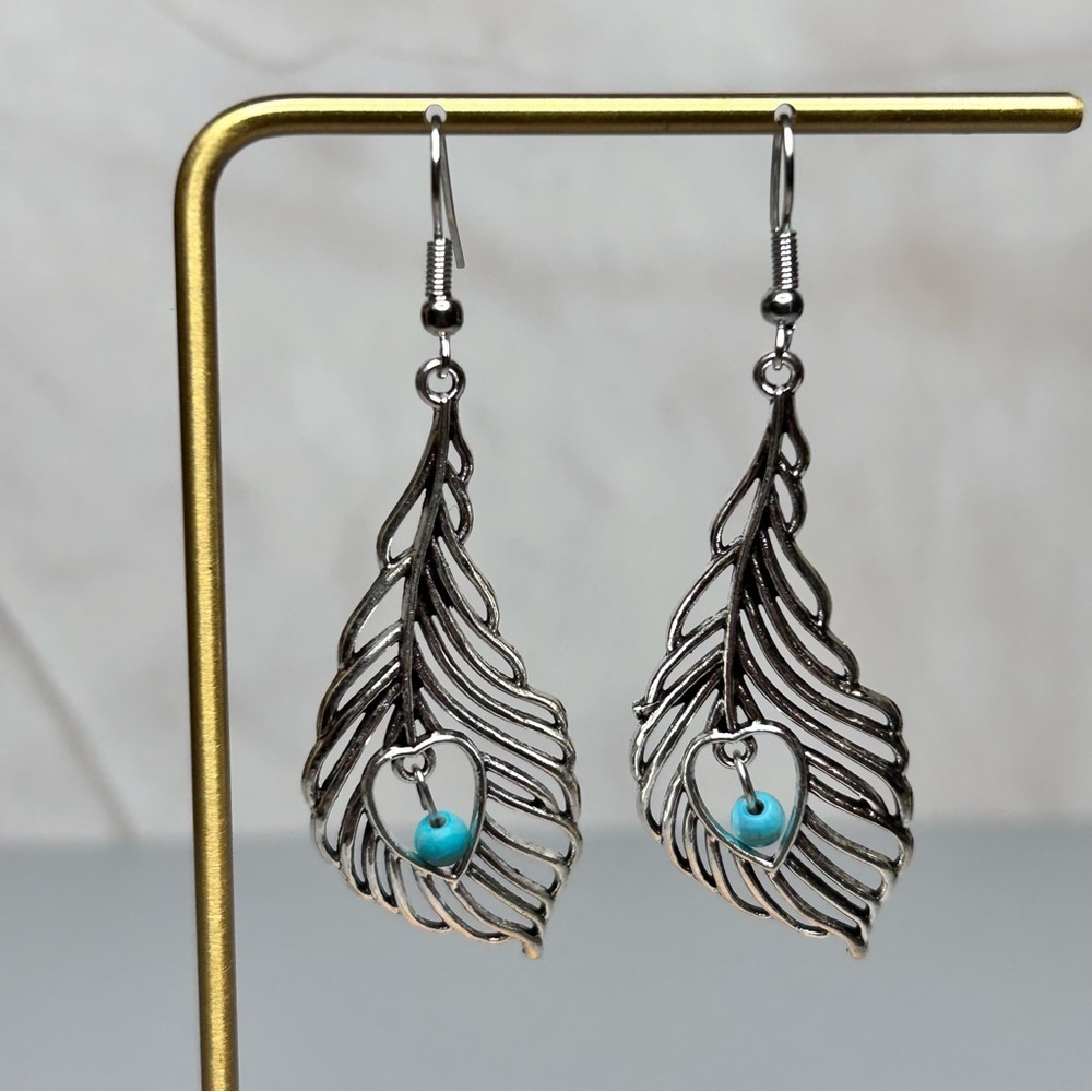 Silver Tone Feather Earrings with Turquoise Stone Accent